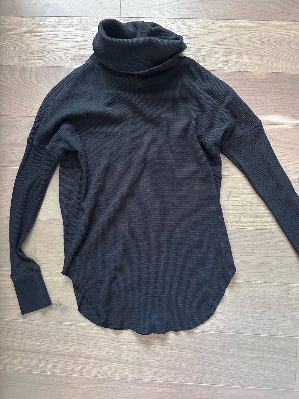 The group by Babaton Black Turtleneck Waffle Knit Top.